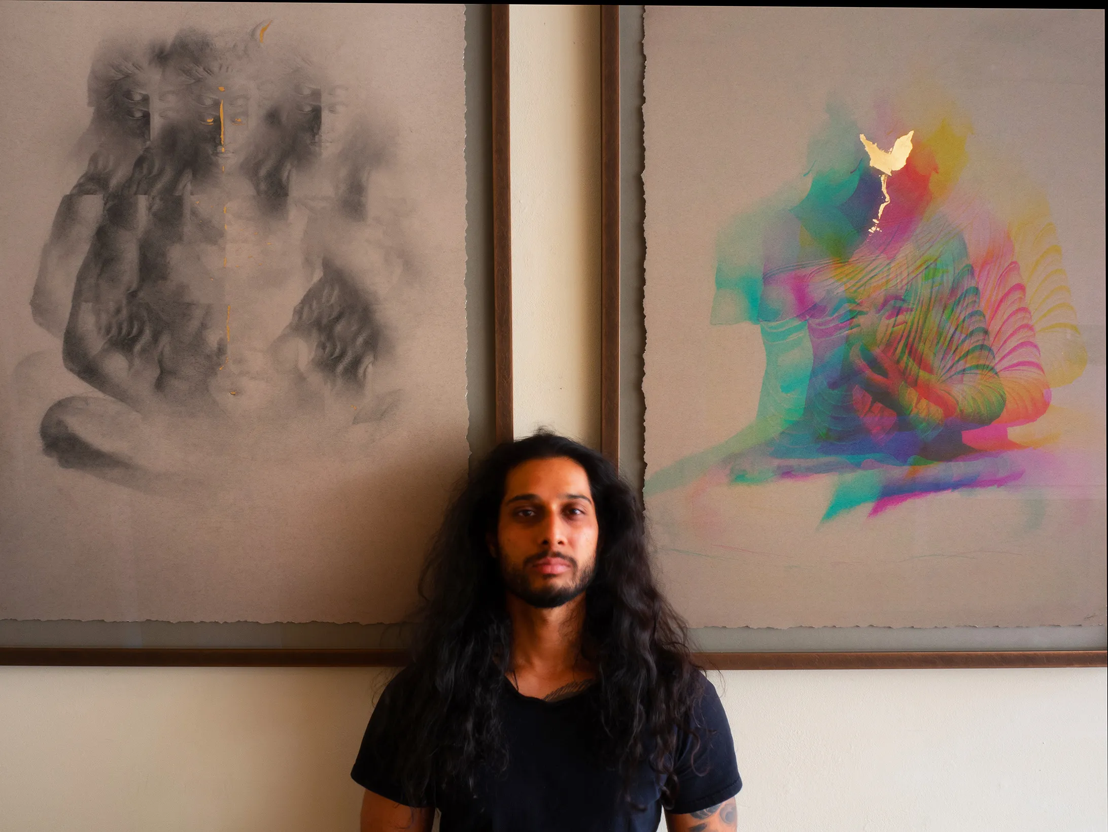 gautama in front of two paintings